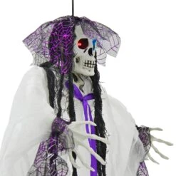 4ft Hanging Skeleton Flashing Eyes Purple Bow Webs Decoration 8 4ft Hanging Skeleton Flashing Eyes Purple Bow Webs Decoration -Halloween Costumes Store XS7452 4 opt